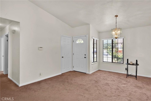 444 Westminister Dr, San Jacinto, CA 92583 - foyer featuring carpet floors and a chandelier