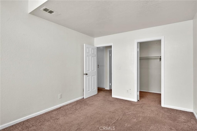 444 Westminister Dr, San Jacinto, CA 92583 - unfurnished bedroom featuring carpet, a spacious closet, and a closet