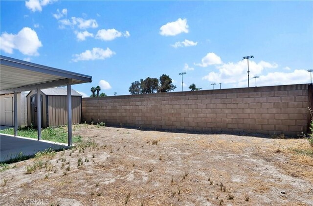 444 Westminister Dr, San Jacinto, CA 92583 - fenced backyard with a shed