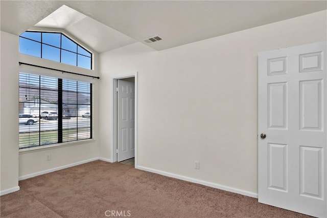 444 Westminister Dr, San Jacinto, CA 92583 - carpeted spare room featuring vaulted ceiling and baseboards