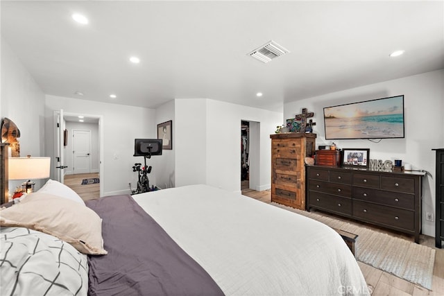 28536 Paseo Diana, San Juan Capistrano, CA 92675 - bedroom with light wood-style flooring, recessed lighting, and a walk in closet