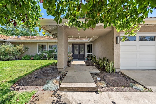 28536 Paseo Diana, San Juan Capistrano, CA 92675 - property entrance featuring french doors, stucco siding, a lawn, an attached garage, and a tile roof