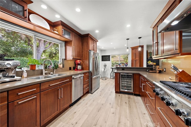 28536 Paseo Diana, San Juan Capistrano, CA 92675 - kitchen featuring beverage cooler, stainless steel appliances, range hood, recessed lighting, and light wood-style flooring