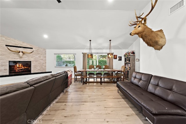 28536 Paseo Diana, San Juan Capistrano, CA 92675 - living area with vaulted ceiling, light wood-style flooring, a stone fireplace, and recessed lighting