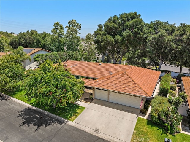 28536 Paseo Diana, San Juan Capistrano, CA 92675 - view of front of home with a tile roof, concrete driveway, and an attached garage