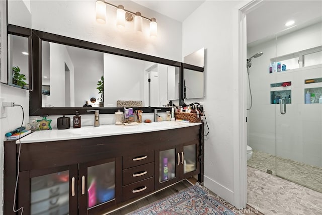 28536 Paseo Diana, San Juan Capistrano, CA 92675 - full bath with double vanity, a shower stall, and wood finished floors