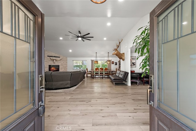 28536 Paseo Diana, San Juan Capistrano, CA 92675 - entrance foyer featuring a ceiling fan, light wood-style floors, recessed lighting, a fireplace, and vaulted ceiling
