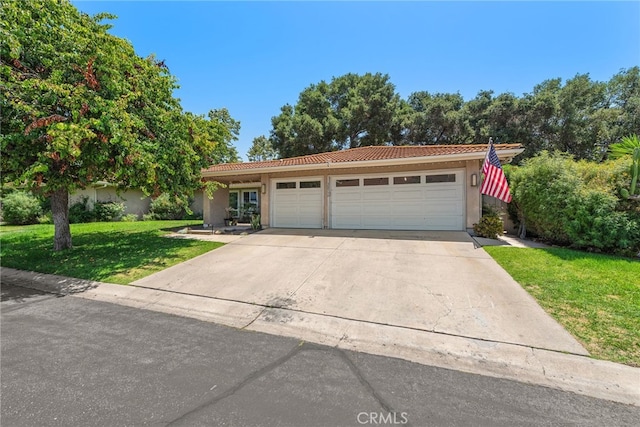 28536 Paseo Diana, San Juan Capistrano, CA 92675 - view of front of home with a tile roof, stucco siding, a front yard, an attached garage, and concrete driveway