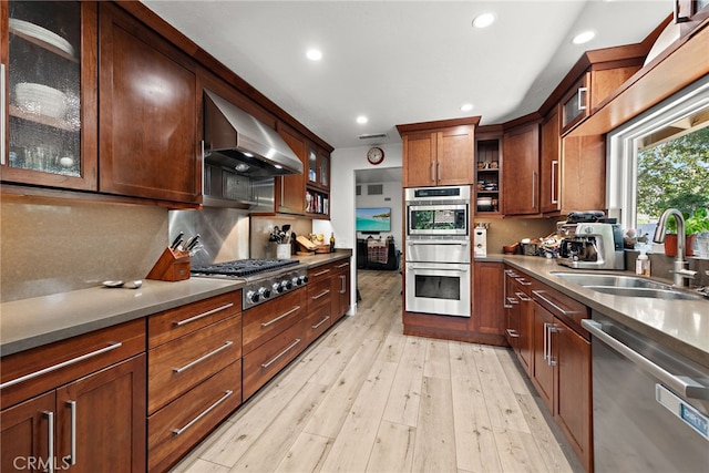 28536 Paseo Diana, San Juan Capistrano, CA 92675 - kitchen with appliances with stainless steel finishes, exhaust hood, recessed lighting, tasteful backsplash, and light wood-type flooring