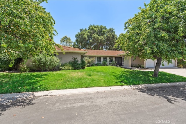 28536 Paseo Diana, San Juan Capistrano, CA 92675 - single story home with concrete driveway, a garage, a front lawn, stucco siding, and a tiled roof