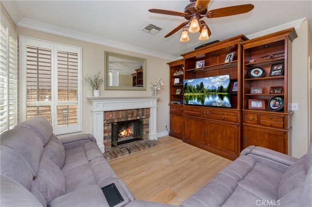 27448 Bridgewater Dr, Valencia, CA 91354 - living area featuring a ceiling fan, light wood-style floors, ornamental molding, and a fireplace