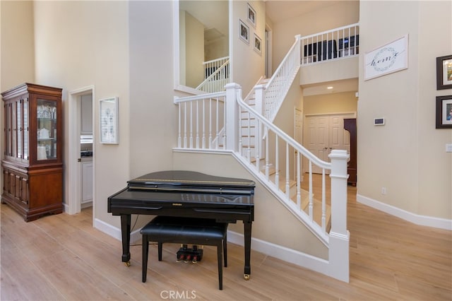 27448 Bridgewater Dr, Valencia, CA 91354 - stairs with a towering ceiling and wood finished floors