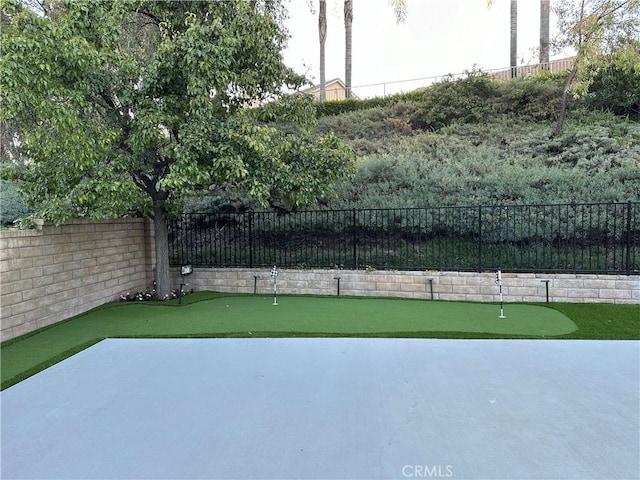 27448 Bridgewater Dr, Valencia, CA 91354 - fenced backyard featuring an area to practice putting and a patio