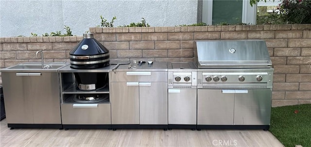 27448 Bridgewater Dr, Valencia, CA 91354 - view of patio with a sink and an outdoor kitchen