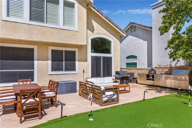 27448 Bridgewater Dr, Valencia, CA 91354 - exterior space featuring an area to practice putting, an outdoor kitchen, and an outdoor hangout area