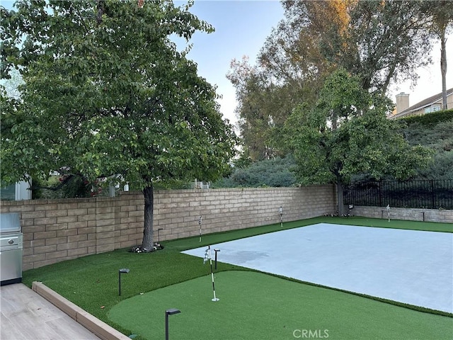 27448 Bridgewater Dr, Valencia, CA 91354 - fenced backyard featuring a putting area and a patio