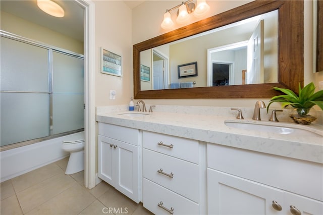 27448 Bridgewater Dr, Valencia, CA 91354 - bathroom with tile patterned floors, double vanity, and combined bath / shower with glass door