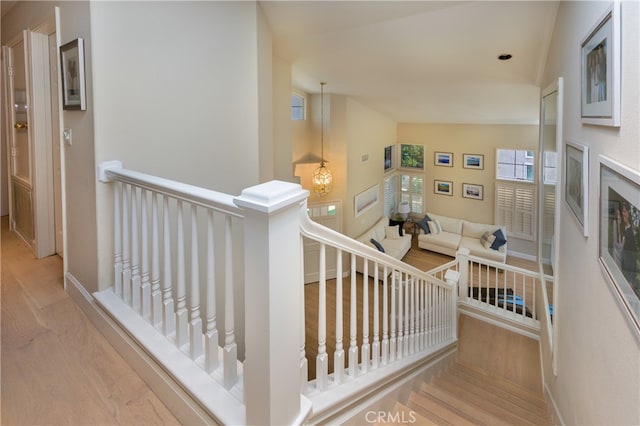 27448 Bridgewater Dr, Valencia, CA 91354 - staircase featuring wood finished floors and vaulted ceiling