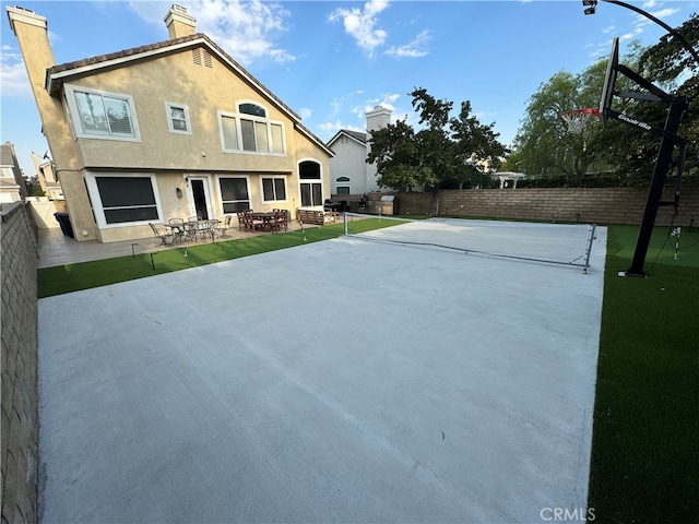 27448 Bridgewater Dr, Valencia, CA 91354 - view of sport court with basketball hoop and a fenced backyard