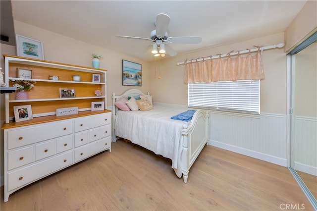 27448 Bridgewater Dr, Valencia, CA 91354 - bedroom featuring light wood finished floors, wainscoting, and a ceiling fan