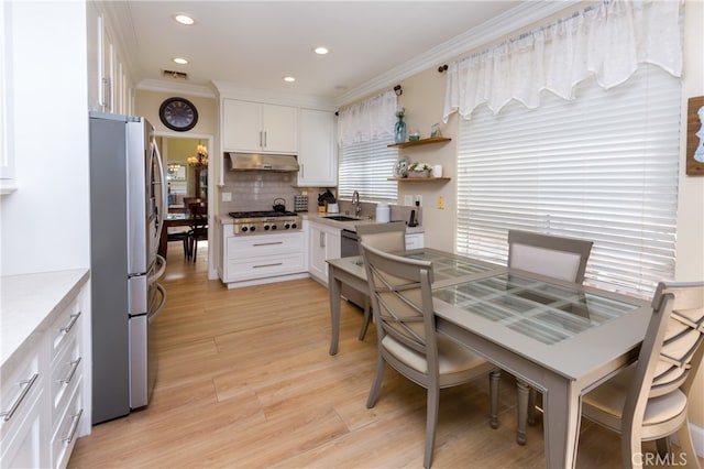 27448 Bridgewater Dr, Valencia, CA 91354 - dining room with crown molding, light wood finished floors, and recessed lighting