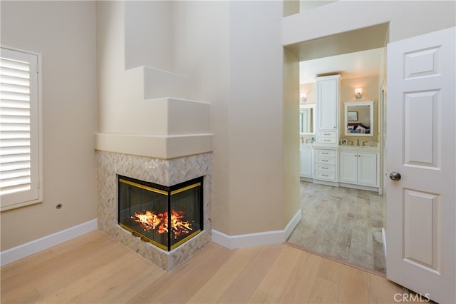 27448 Bridgewater Dr, Valencia, CA 91354 - unfurnished living room with light wood-style floors and a high end fireplace