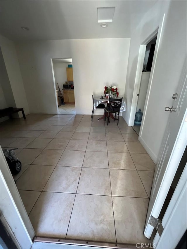 1248 Rolland Curtis Pl, Los Angeles, CA 90037 - dining area with light tile patterned floors