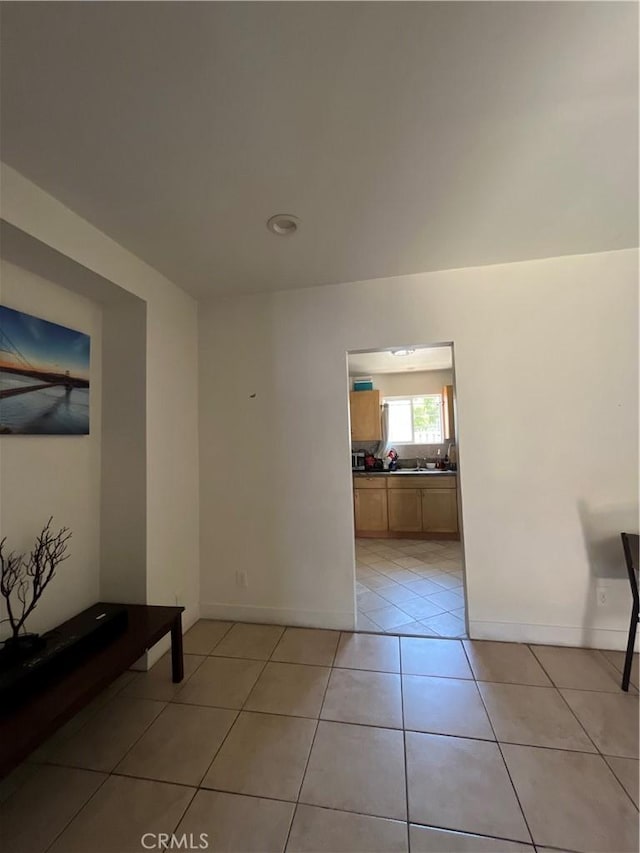1248 Rolland Curtis Pl, Los Angeles, CA 90037 - unfurnished room featuring light tile patterned floors and baseboards