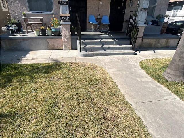 1248 Rolland Curtis Pl, Los Angeles, CA 90037 - property entrance with a porch and stucco siding