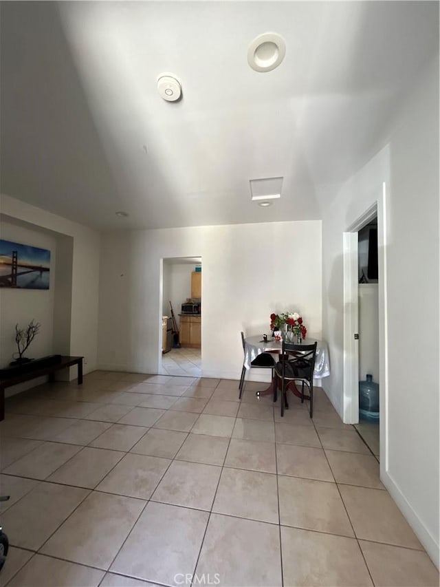 1248 Rolland Curtis Pl, Los Angeles, CA 90037 - dining space with light tile patterned floors