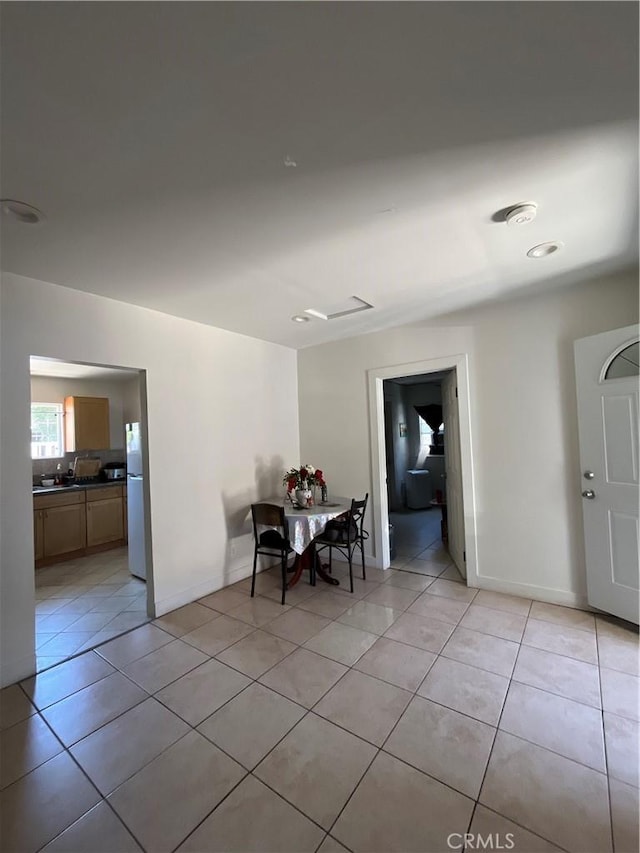 1248 Rolland Curtis Pl, Los Angeles, CA 90037 - dining area featuring light tile patterned floors