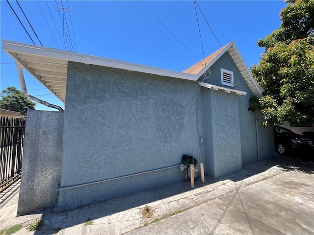1248 Rolland Curtis Pl, Los Angeles, CA 90037 - view of side of property featuring stucco siding
