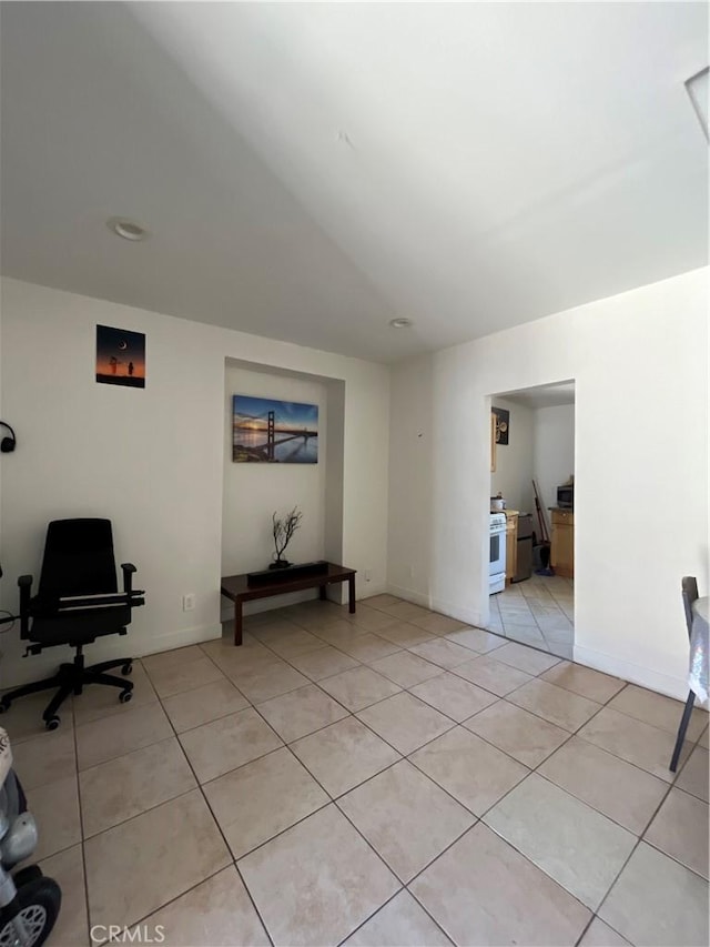 1248 Rolland Curtis Pl, Los Angeles, CA 90037 - living area with a desk and light tile patterned floors