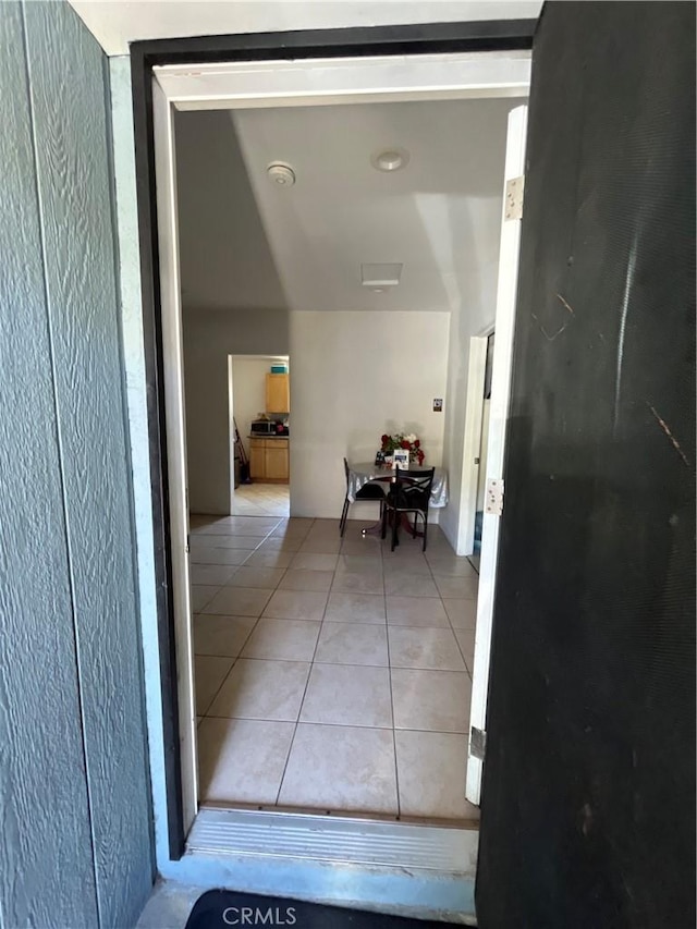 1248 Rolland Curtis Pl, Los Angeles, CA 90037 - corridor featuring light tile patterned flooring