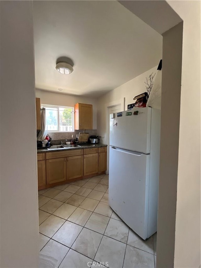 1248 Rolland Curtis Pl, Los Angeles, CA 90037 - kitchen featuring freestanding refrigerator and dark countertops