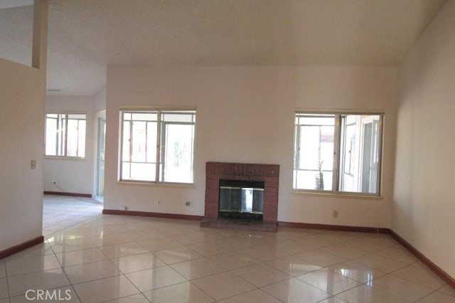 18065 Dorsey Way, Fontana, CA 92335 - unfurnished living room with light tile patterned floors and a fireplace