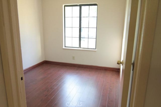 18065 Dorsey Way, Fontana, CA 92335 - empty room featuring plenty of natural light and dark wood-style floors