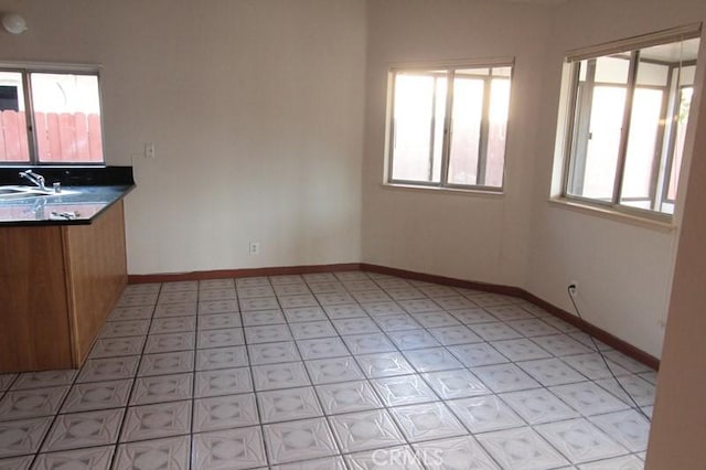 18065 Dorsey Way, Fontana, CA 92335 - unfurnished dining area featuring baseboards