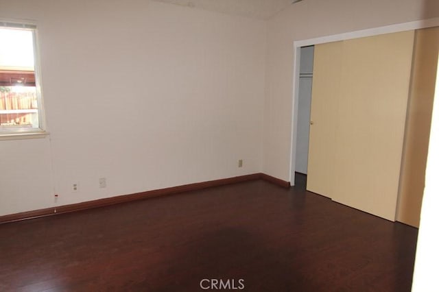 18065 Dorsey Way, Fontana, CA 92335 - unfurnished bedroom with dark wood-type flooring and a closet