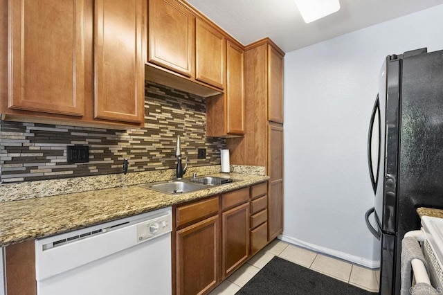 1240 N Broadway Unit 30, Escondido, CA 92026 - kitchen featuring dishwasher, freestanding refrigerator, tasteful backsplash, light tile patterned flooring, and brown cabinetry