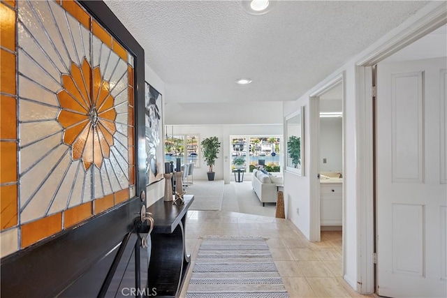 612 Harbor Island Dr, Newport Beach, CA 92660 - hallway featuring a textured ceiling, tile patterned flooring, and recessed lighting