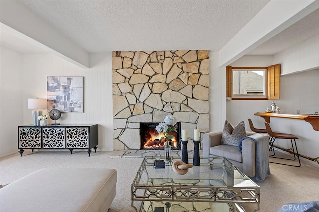 612 Harbor Island Dr, Newport Beach, CA 92660 - living area with carpet floors, a textured ceiling, and a stone fireplace