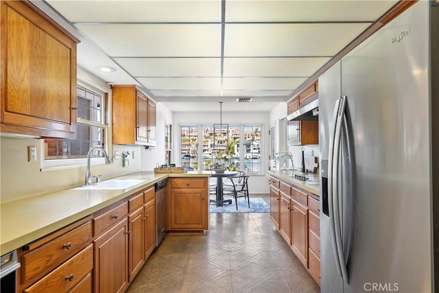 612 Harbor Island Dr, Newport Beach, CA 92660 - kitchen featuring stainless steel appliances, brown cabinetry, light countertops, and recessed lighting
