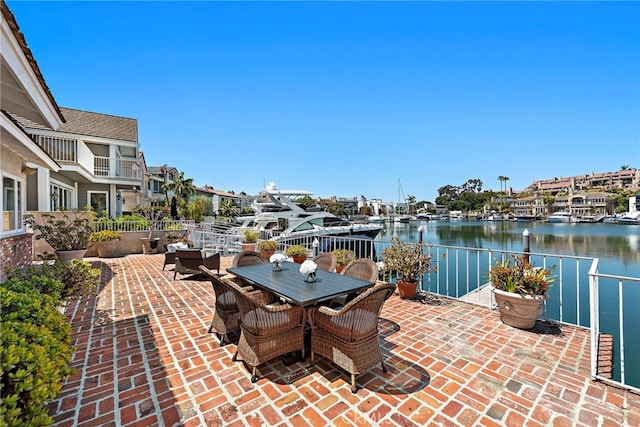 612 Harbor Island Dr, Newport Beach, CA 92660 - view of patio / terrace featuring a water view and outdoor dining space