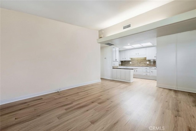 13300 Twin Hills Dr Unit 46A, Seal Beach, CA 90720 - unfurnished living room with light wood-style floors and baseboards