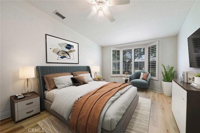13300 Twin Hills Dr Unit 46A, Seal Beach, CA 90720 - bedroom featuring light wood-type flooring, vaulted ceiling, and ceiling fan