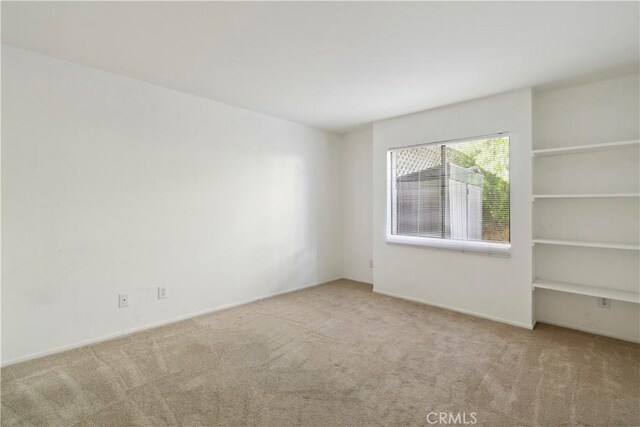 1745 Los Feliz Dr Unit 2, Thousand Oaks, CA 91362 - carpeted empty room featuring baseboards