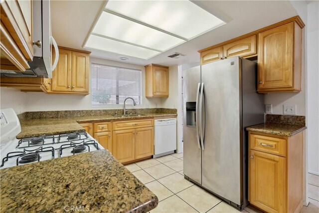 1745 Los Feliz Dr Unit 2, Thousand Oaks, CA 91362 - kitchen with white appliances, light tile patterned floors, and dark stone countertops