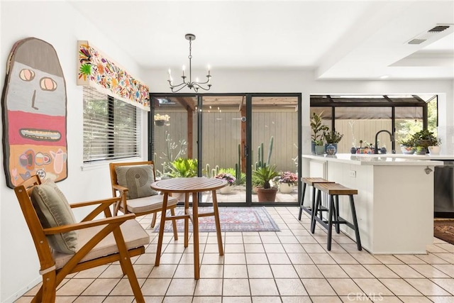 34 Pebblewood Pines Dr, Chico, CA 95926 - dining space featuring a chandelier and light tile patterned floors