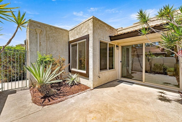 9866 Lido Way Unit 20, Cypress, CA 90630 - doorway to property featuring stucco siding and a patio